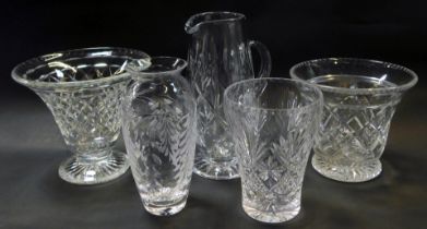 A group of cut glass, comprising jug, 24cm high, vase of cylindrical tapering form, 20cm high, and