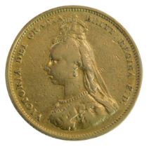 A Queen Victoria gilded shilling, dated 1887.