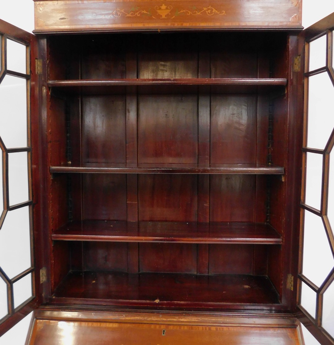 A late 19thC mahogany and inlaid bureau bookcase, the top with swan neck pediment above a - Image 2 of 5