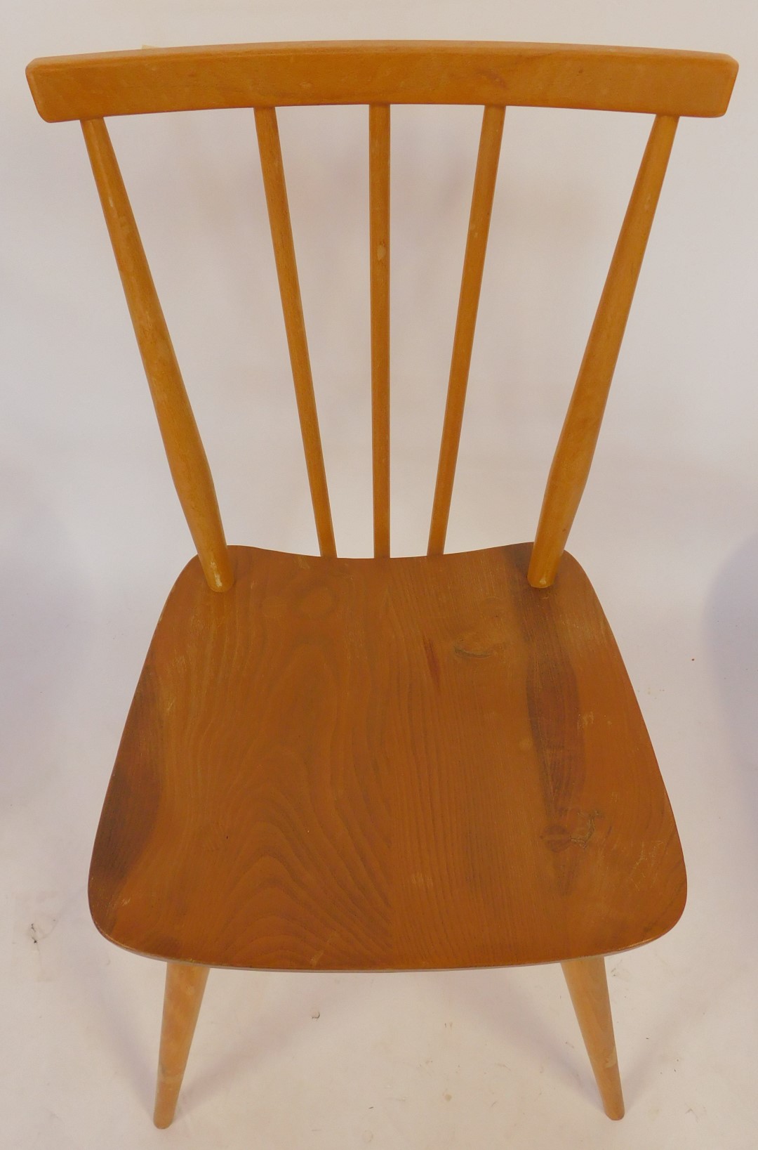 A set of four Ercol elm and beech dining chairs, model number 391, some bearing labels and each - Image 2 of 3