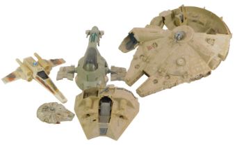 A Star Wars model of the Millennium Falcon, together with a X-Wing Fighter and a Slave 1 Ship.