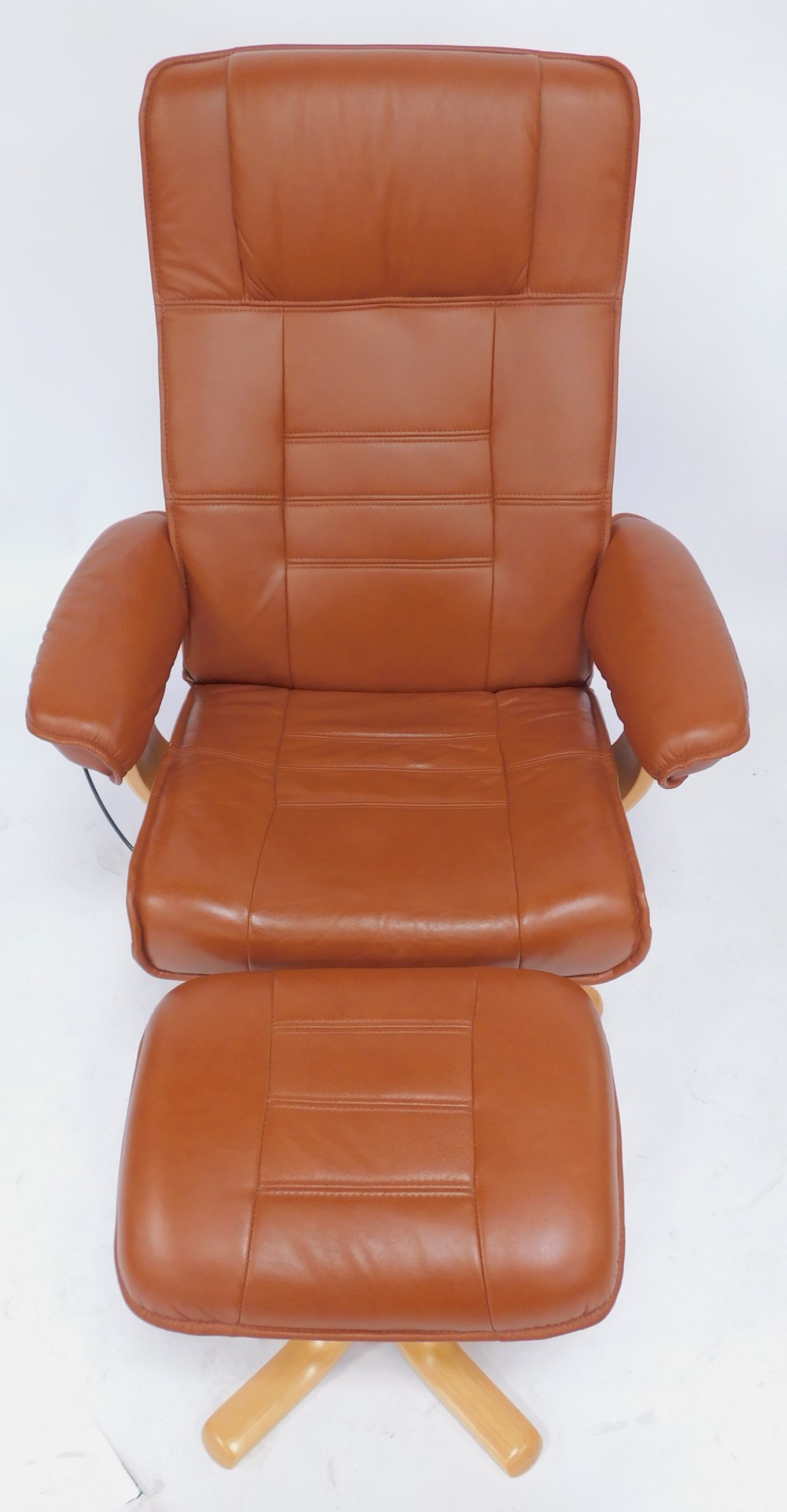 A Stressless style armchair, upholstered in brown leather, on a beech base, with matching - Image 2 of 3