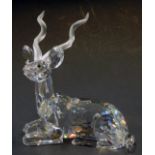 A Swarovski crystal figure modelled as a seated antelope, 12cm high.