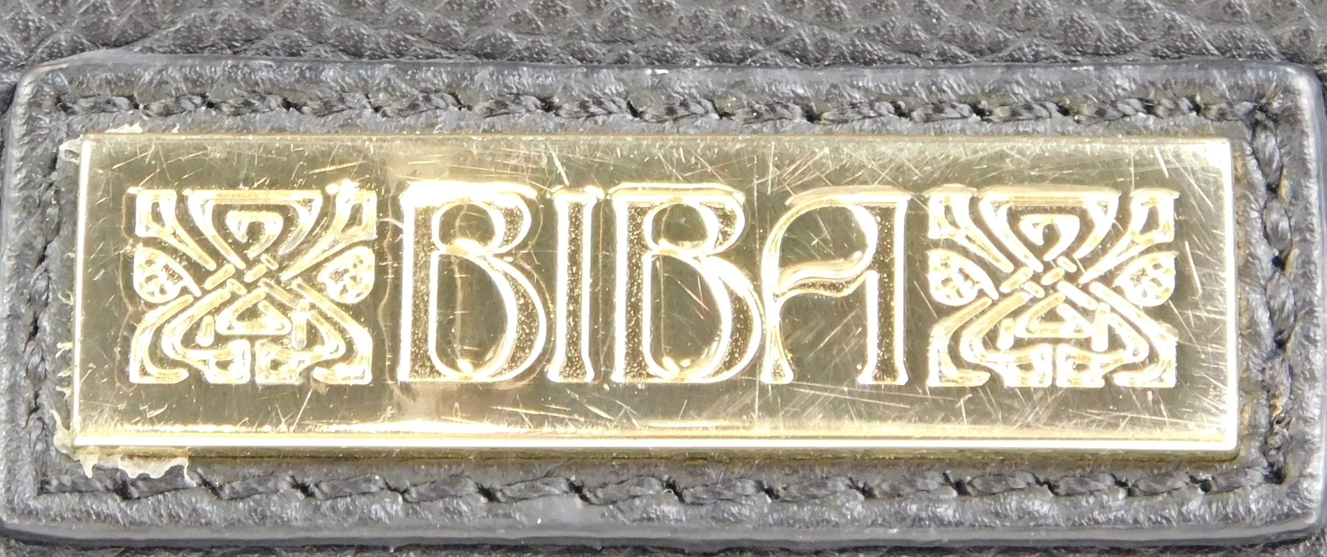 A Biba London black leather handbag, the front flap with heat press Biba logo, enclosing three - Image 2 of 2