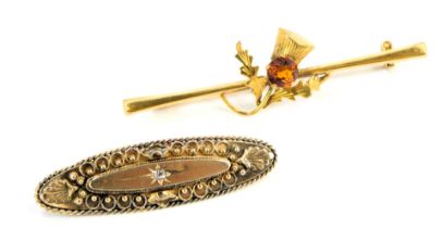 Two bar brooches, comprising a thistle bar brooch set with central citrine, yellow metal stamped
