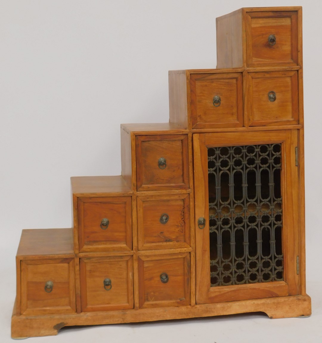 An Eastern mango wood cabinet, of stepped design, with an arrangement of nine drawers, with an - Image 2 of 4