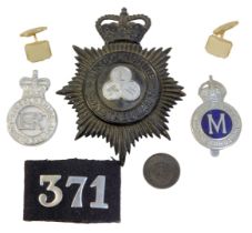 A Lincolnshire Constabulary helmet badge, stamped LKH, two other smaller badges, etc.