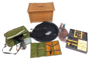 A group of fishing tackle, to include a wicker fishing box, 57cm wide, nets, canvas bag and