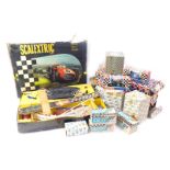 A group of Scalextric, to include a box containing track, cars, etc., together with further track,