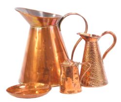 A group of copper, comprising large jug, 36cm high, a bowl, stamped to underside CB Hand Crafted