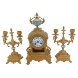 A 19thC French gilt metal and enamelled clock garniture, the white enamel circular dial bearing