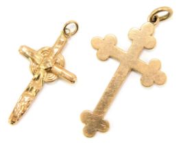 Two crucifix pendants, comprising one of plain design stamped 375, and another of hammered design