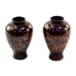 A pair of Oriental cloisonne vases, each of baluster form decorated to the front with a reserve of