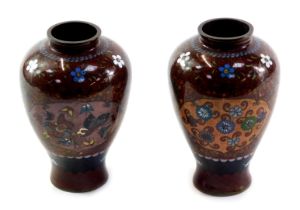 A pair of Oriental cloisonne vases, each of baluster form decorated to the front with a reserve of