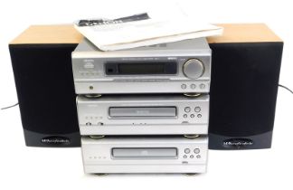 A Denon music system, comprising stereo receiver, stereo cassette tape deck, and compact disc