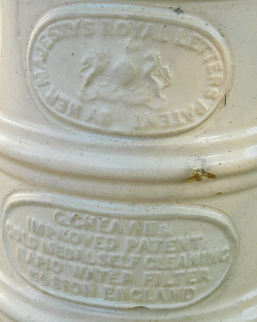 A stoneware water filter, stamped Her Majesty's Royal Letters, on cream finish with lion mask - Image 3 of 3