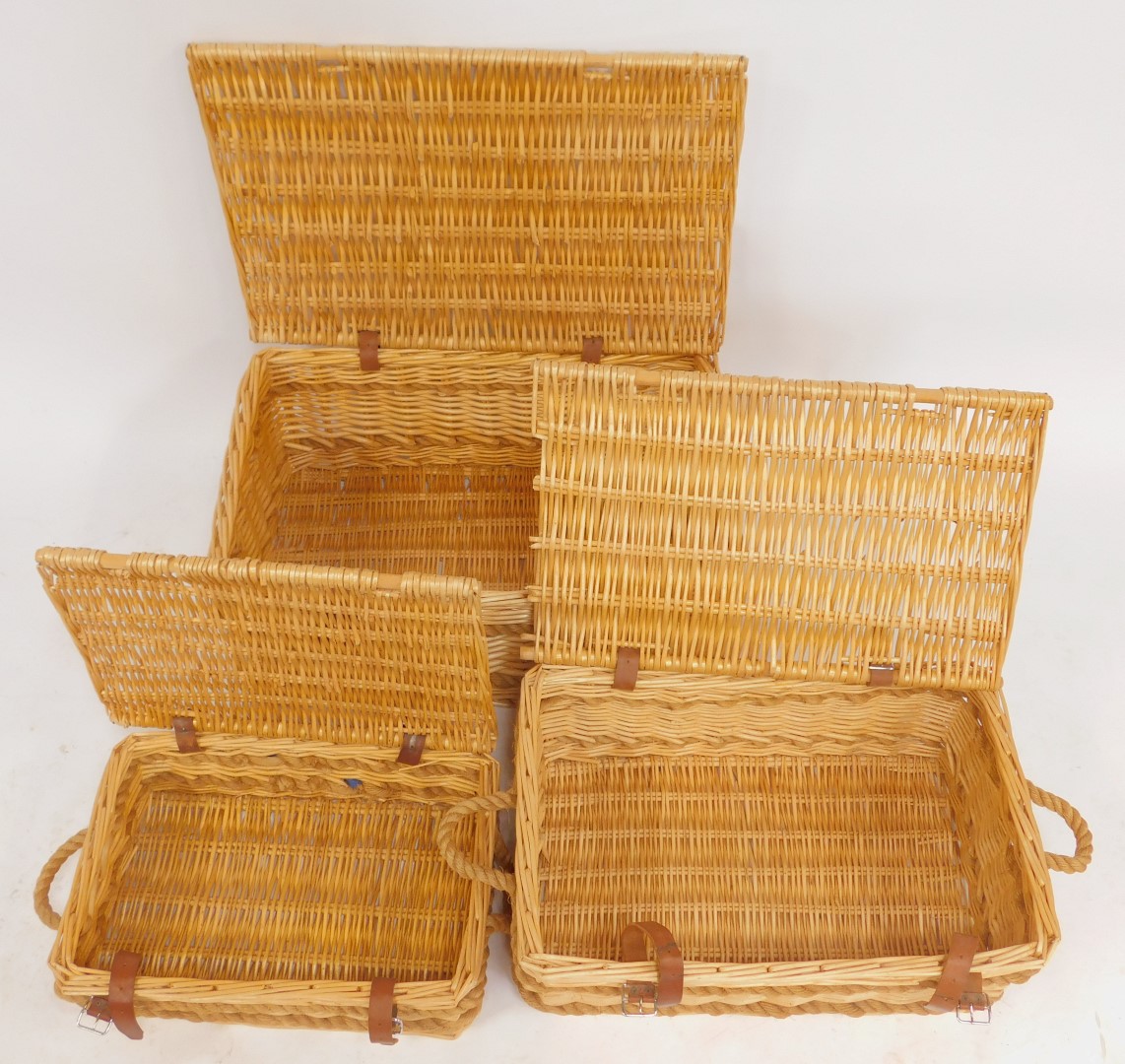 A graduated set of three wicker hampers, with brown leather straps, the largest 77cm wide. - Image 3 of 3