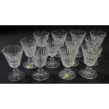 A set of twelve Waterford crystal Tramore pattern port glasses, each 10cm high, some with paper