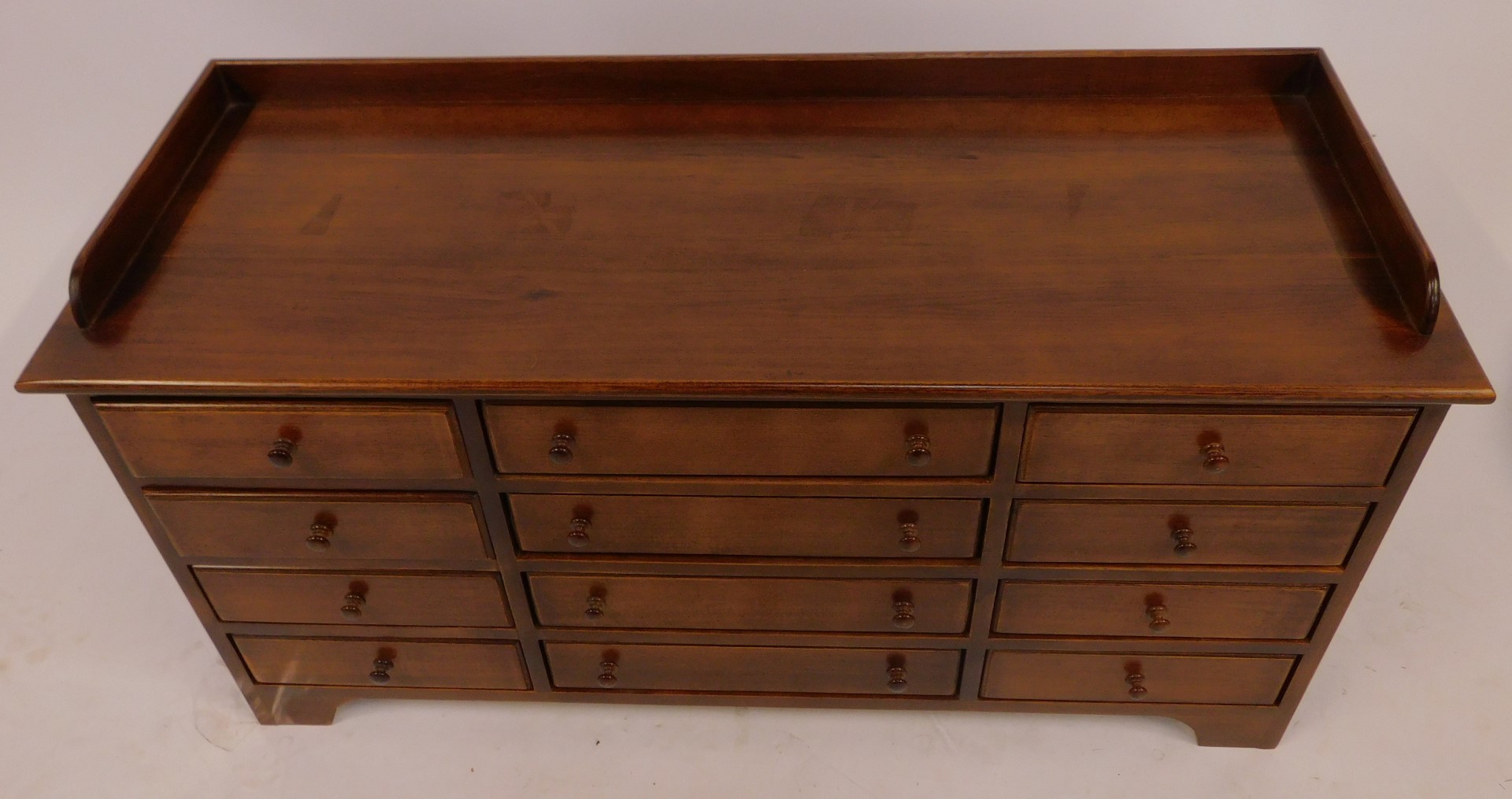 A 20thC mahogany collectors cabinet, the top with a raised back above an arrangement of twelve - Image 2 of 3