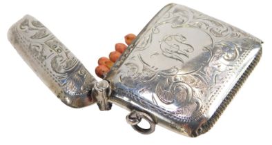 A George V silver vesta case, with engraved foliate decoration, shield reserve, monogram engraved,