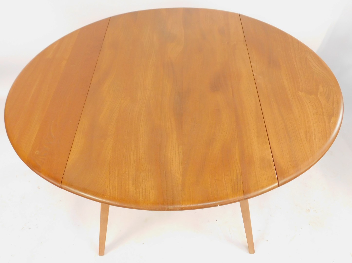 An Ercol elm drop leaf dining table, the top with a rounded edge, raised on square tapering out - Image 2 of 4