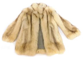A fur short jacket, in white and brown, possibly fox, underarm measurement approx 36cm wide.