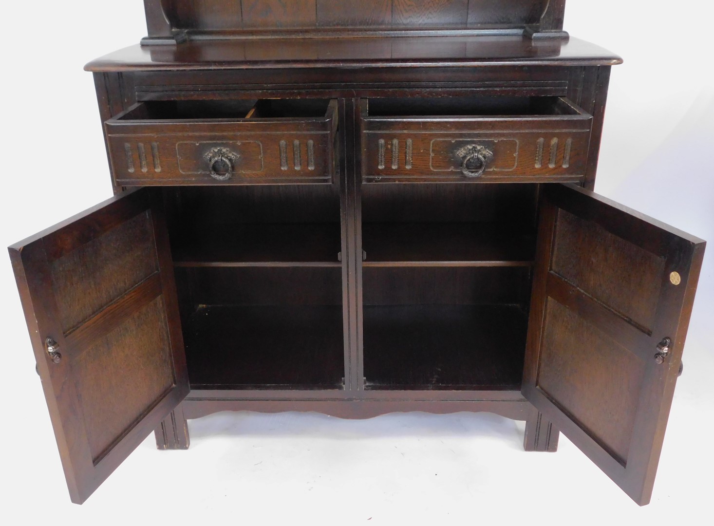 A 20thC oak dresser, the arched top with two plate shelves, the base with two drawers above two - Image 3 of 4