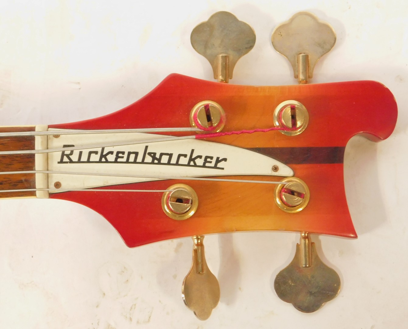 A Rirkenbacker electric bass guitar, the body in red, with the front panel fading to a yellow, the - Image 4 of 7