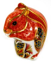 A Royal Crown Derby porcelain red squirrel paperweight, red printed marks and gold stopper, 9cm
