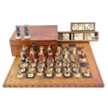 A 20thC chess set, the leather chess board, with outer stud work, 51cm x 51cm, together with various