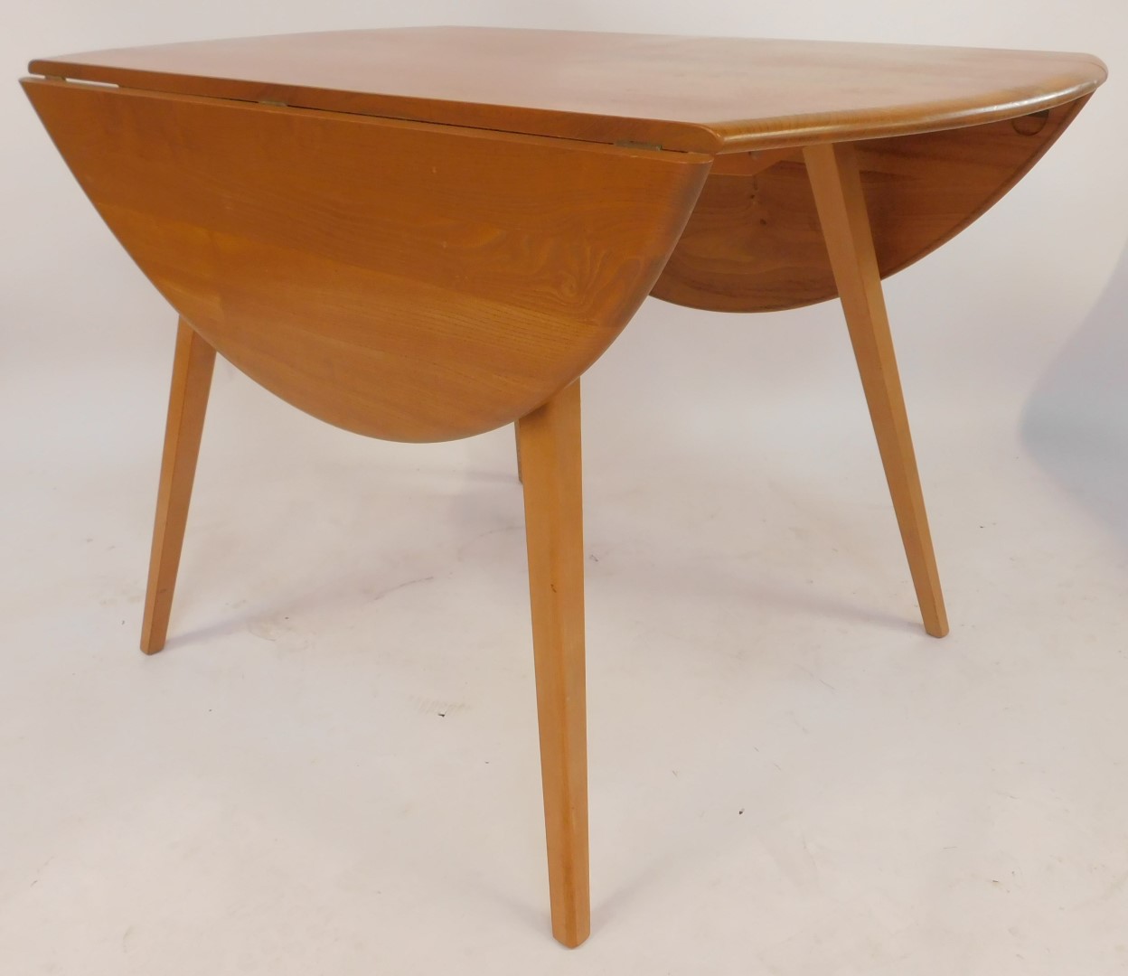 An Ercol elm drop leaf dining table, the top with a rounded edge, raised on square tapering out - Image 3 of 4