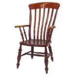 A 20thC stained beech grandfather type chair, with solid rail, lath back, scrolling arms, solid