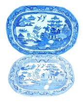 A 19thC blue and white willow pattern oval platter, 52cm wide, and a Staffordshire ironstone