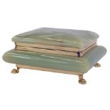 A 1920s green onyx cigarette box, the rectangular hinged top opening to reveal a vacant interior