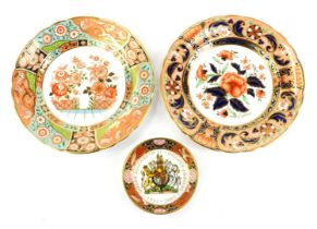 Two Royal Crown Derby porcelain plates, decorated in the Regency Flowers pattern, and the Derby Pink