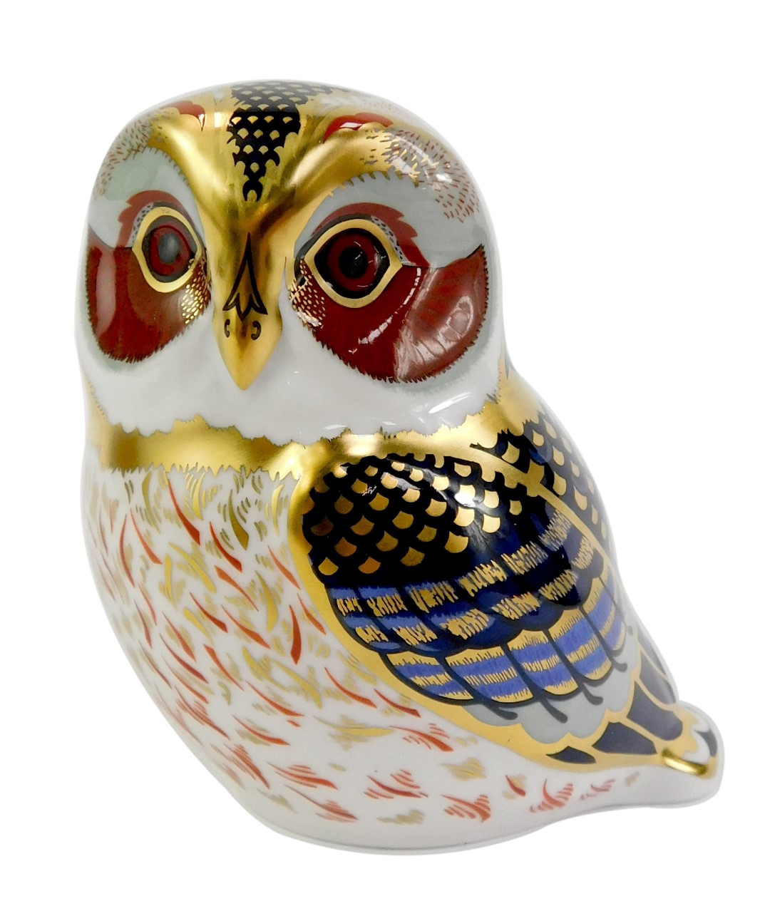 A Royal Crown Derby porcelain tawny owl paperweight, red printed marks and gold stopper, 9cm high,