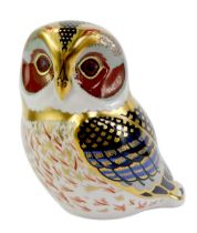 A Royal Crown Derby porcelain tawny owl paperweight, red printed marks and gold stopper, 9cm high,