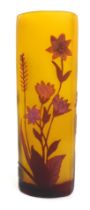 A Galle style glass vase, of curved triangular form, with floral cameo decoration in purple