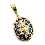 A lapis oval pendant, with pierced and raised elephant god decoration, on an arched pendant,