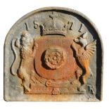 A cast iron fire grate back, raised relief with lions dated 1571 with crown, 72cm high, 70cm wide.
