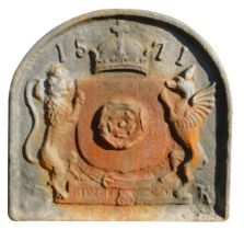 A cast iron fire grate back, raised relief with lions dated 1571 with crown, 72cm high, 70cm wide.
