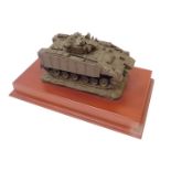 A Martin Duchemin armored tank model, bronzed effect set on a yew wood rectangular base, 12cm