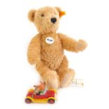 A Steiff Elmar jointed Teddy bear, 32cm high, and a Corgi Basil Brush car.