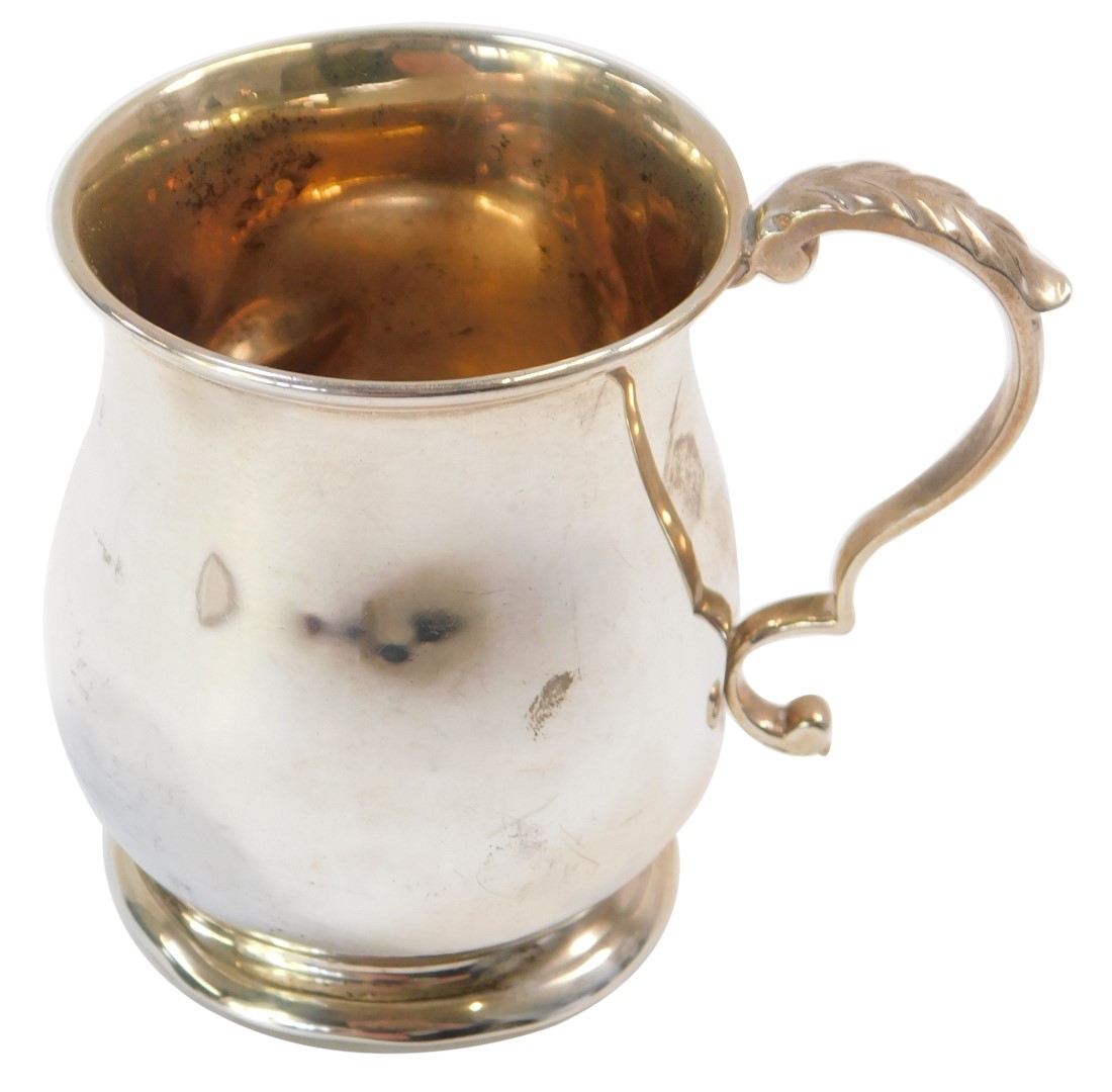 A George VI silver christening mug, with ribbed collar, on stepped foot with acanthus leaf handle,