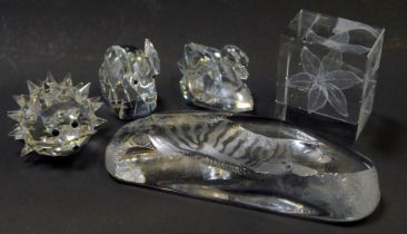 A group of Swarovski crystal, comprising an elephant, 6cm high, swan, 5cm high, and a hedgehog,