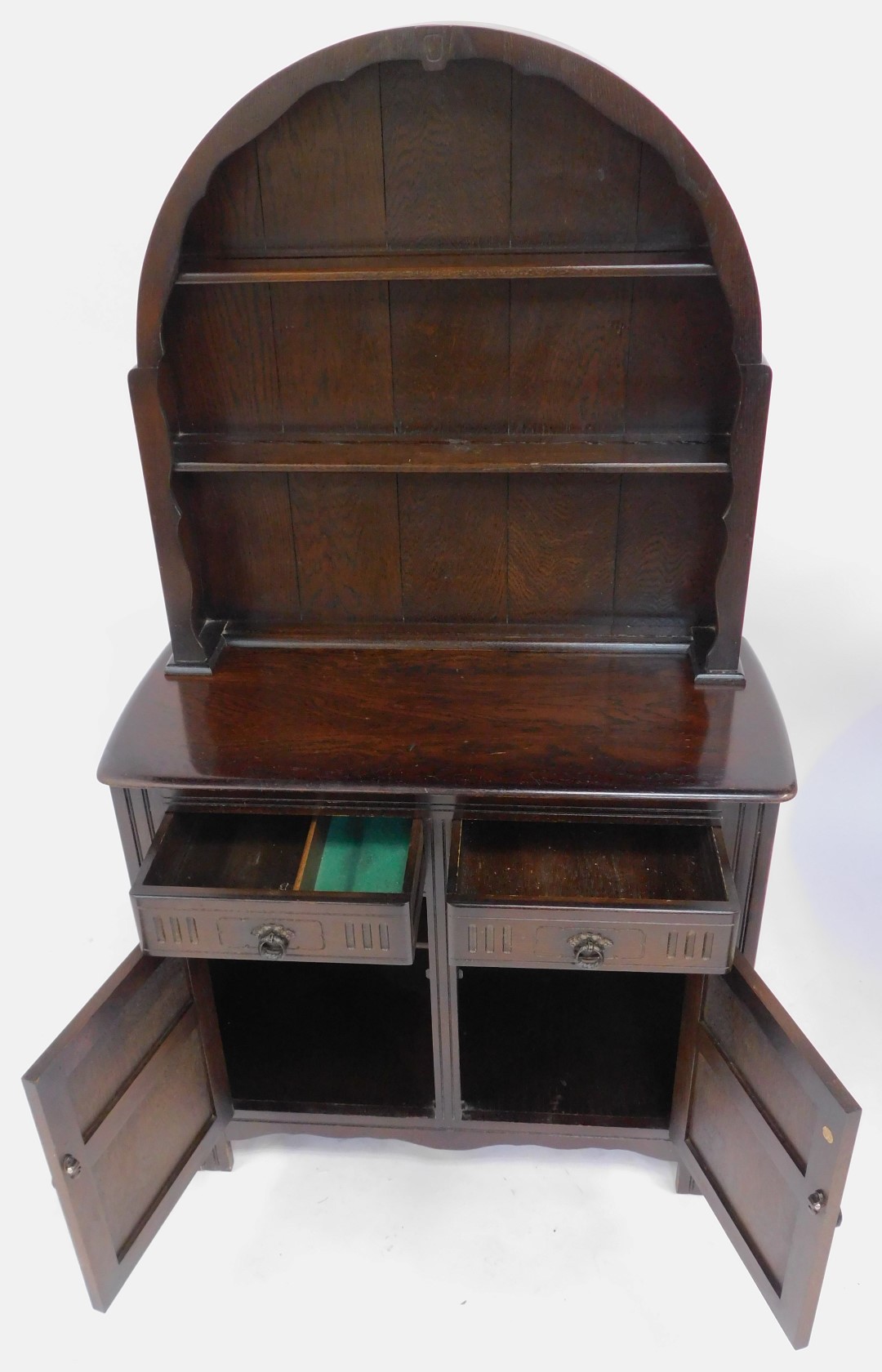 A 20thC oak dresser, the arched top with two plate shelves, the base with two drawers above two - Image 2 of 4