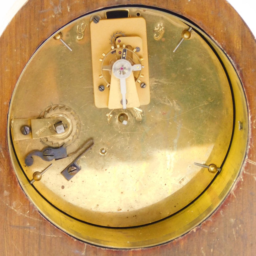 An early 20thC mahogany mantel clock, the circular white enamel dial bearing Roman numerals, key - Image 3 of 3