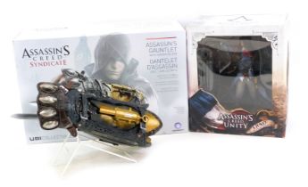 An Assasin's Creed Unity Arno Fearless Assassin figure, boxed, together with a UBI Collectables
