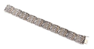 An abstract silver bracelet, the links of rectangular form with brushed links, 19cm long, 33.3g.
