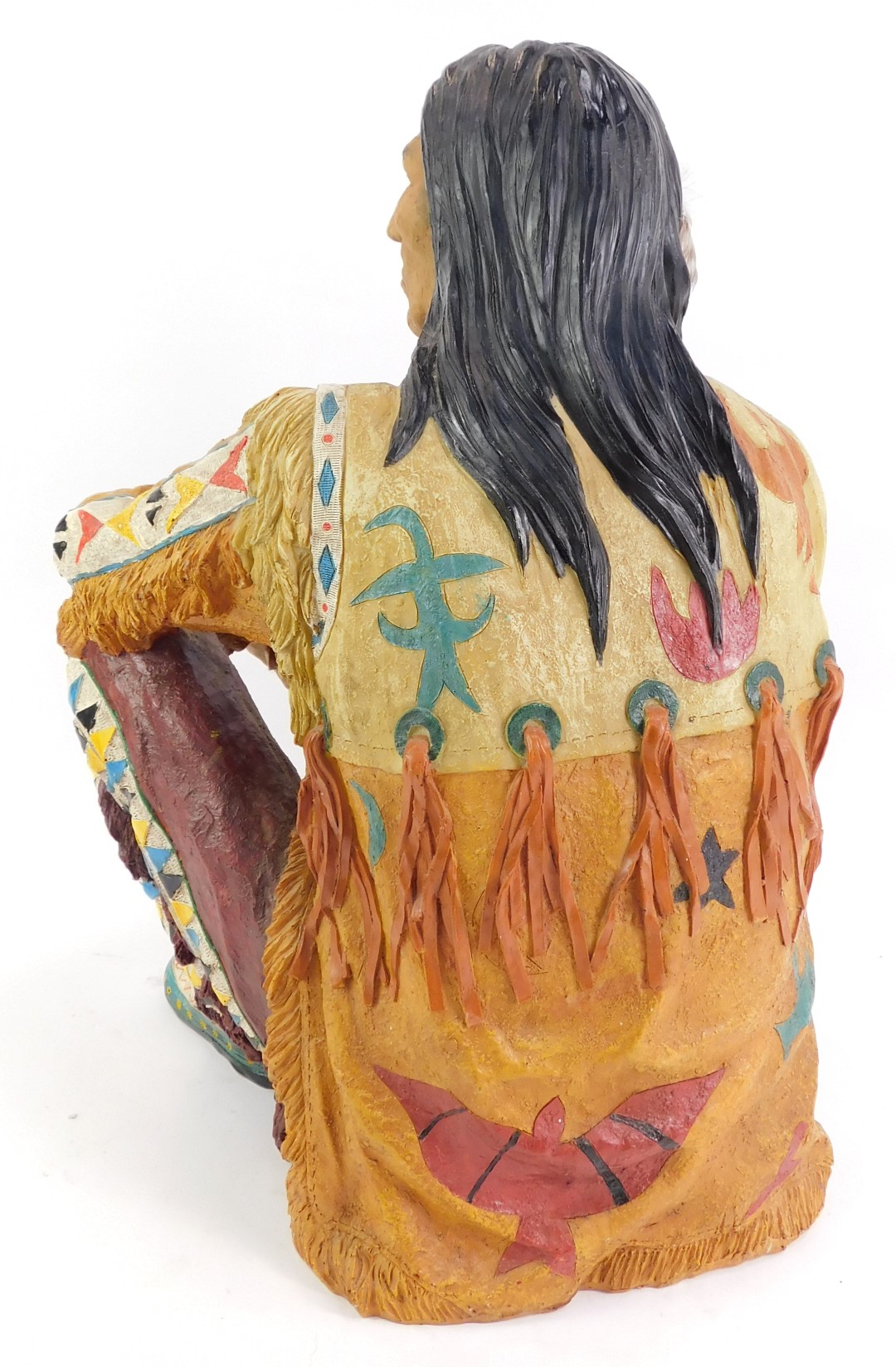 A 20thC resin figure modelled as a Native American seated, with feathered fan, 43cm high. - Image 2 of 2